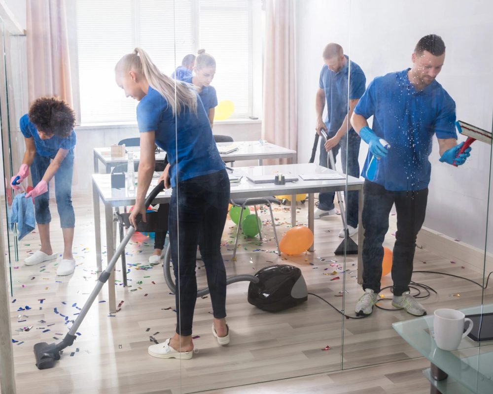 imgi_123_group-young-janitors-cleaning-office-93946094